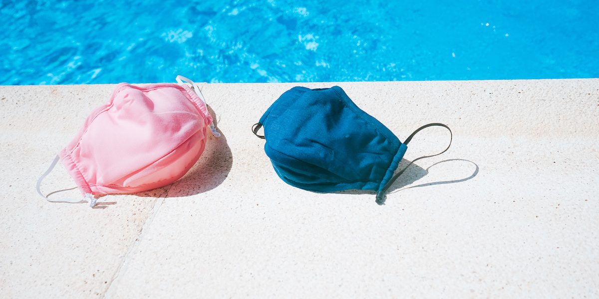 Protective mask near a swimming pool in summer